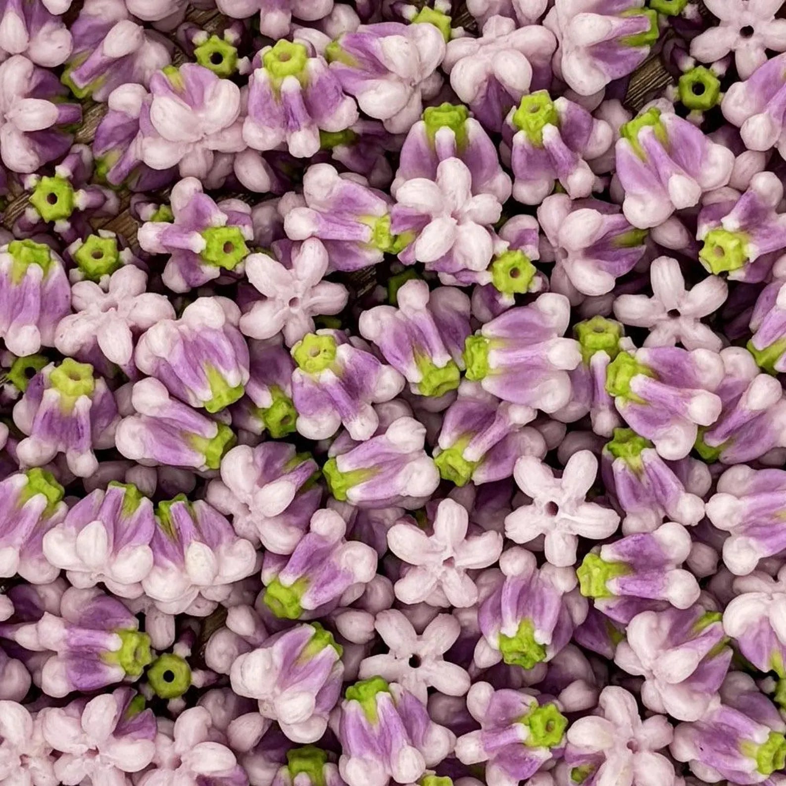 Purple and white handmade clay crown flower beads for Hawaiian leis and jewelry